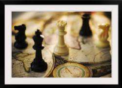 Chess pieces on old world map