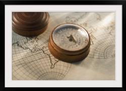 Antique compass on map