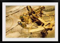 Sextant on top of world maps