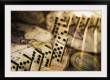 Row of dominoes on old world map